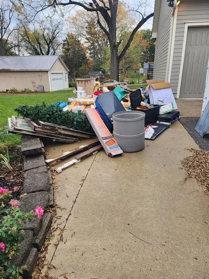 Dumpster being loaded with debris for Estate Cleanout Dumpster Rental in New Holland